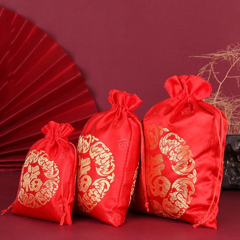 ภาพหน้าปกสินค้าถุงหูรูด สีแดง สไตล์จีน สร้างสรรค์ สําหรับใส่ขนมหวาน ตกแต่งงานแต่งงาน ของขวัญ จากร้าน lavenderfashion.th บน Shopee