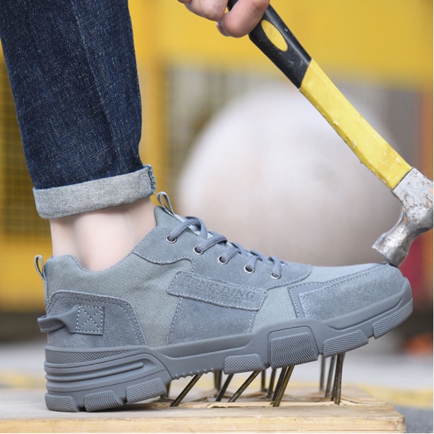ภาพหน้าปกสินค้ารองเท้าเซฟตี้ รองเท้านิรภัย รองเท้านิรภัยผู้ชาย ระบายอากาศได้ ป้องกันการชนและป้องกันการแทง จากร้าน tapricotac บน Shopee