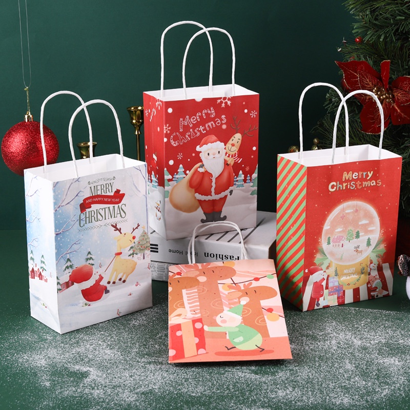 ภาพหน้าปกสินค้าถุงกระดาษซานตาคลอสสีแดงพิมพ์ลาย Merry Christmas สําหรับใส่ของขวัญ จากร้าน vison88.th บน Shopee