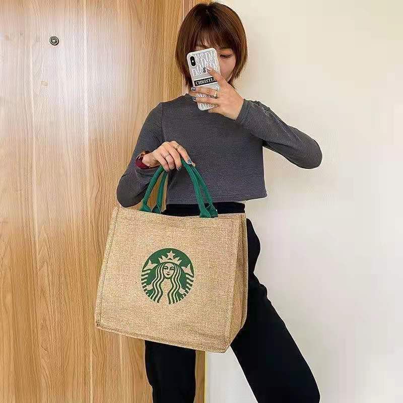 ภาพหน้าปกสินค้ากระเป๋าสตาร์บัคStarbucksย้อนยุคถุงผ้าลินินผ้าฝ้ายหยาบถุงผ้าลินินกันน้ำด้วยฟิล์มการคุ้มครองสิ่งแวดล้อมแฟชั่นที่เรียบง่าย จากร้าน zwzhou บน Shopee