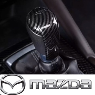 ภาพขนาดย่อของสินค้าครอบเกียร์ เคฟล่า Mazda 2,3,CX-3,CX-5 พร้อมสัญลักษณ์ RS
