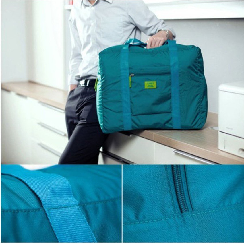 ภาพหน้าปกสินค้ากระเป๋าเดินทางพับย่อส่วนได้ ใช้แขวนพ่วงกระเป๋าล้อลากได้รุ่น Folding Bag01 - สี Marine Blue จากร้าน tips2keep บน Shopee