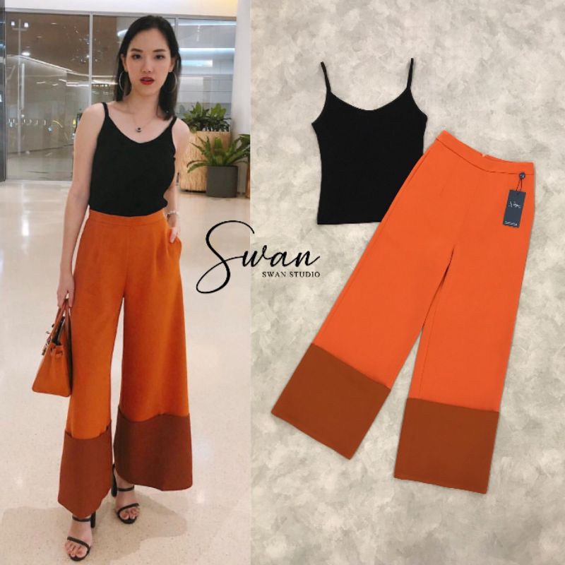 swan-studio-เซทเสื้อสายเดี่ยวสีดำ-ผ้ายืดมากับกางเกงขายาวสีส้ม