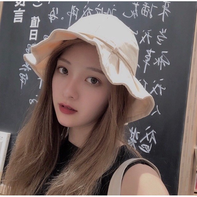 รูปภาพของหมวกบักเก็ตเกาหลีผูกโบว์ สีพื้น Dollyลองเช็คราคา