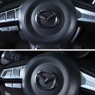 ภาพหน้าปกสินค้าครอบโลโก้พวงมาลัยเคฟล่า  Mazda2,3 CX3 ,CX5  Skyactivทุกรุ่น ที่เกี่ยวข้อง