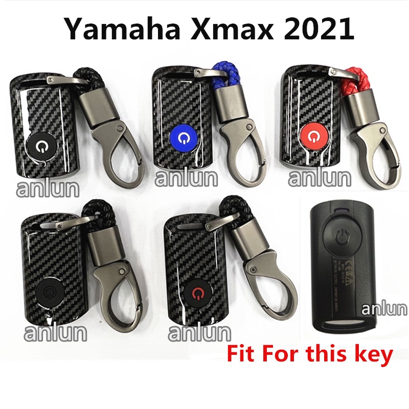 ภาพหน้าปกสินค้าเคสกุญแจรีโมตรถจักรยานยนต์ คาร์บอนไฟเบอร์ พร้อมพวงกุญแจ สําหรับ Yamaha XMAX 300 2021