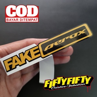 สติกเกอร์ พิมพ์ลาย FAKE AEROX กันน้ํามันวาว สําหรับติดตกแต่งหมวกกันน็อค รถจักรยานยนต์ รถยนต์