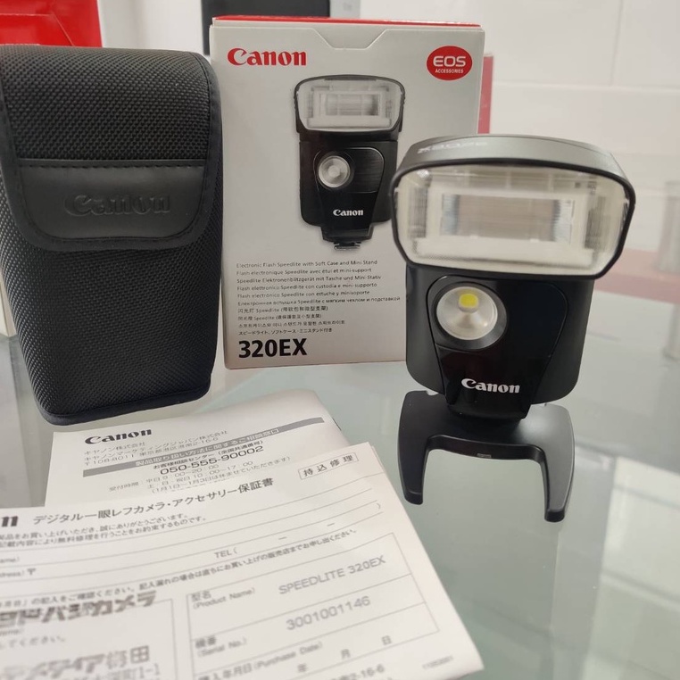 Flash Canon Speedlite 320EX มือสองสภาพดี หน้าขาว มาพร้อมกล่อง ขาตั้ง ใบ