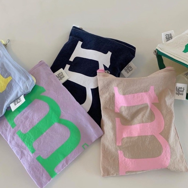ภาพหน้าปกสินค้ากระเป๋าผ้า Minmin1of1 Color Pouch จากร้าน soxstuff บน Shopee