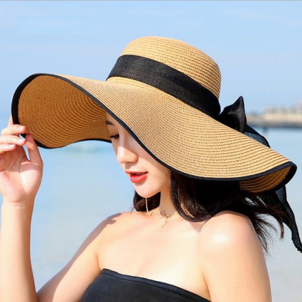 ราคาและรีวิวหมวกสานผู้หญิง  หมวกปีกกว้าง หมวกเที่ยวทะเล ขอบสีดำ โบว์สีดำ มี สีขาว ครีม น้ำตาล