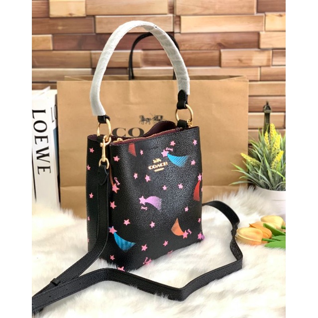 coach-small-town-bucket-bag-with-disco-star-print