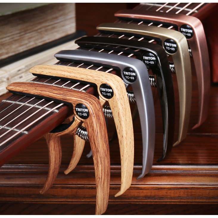 ภาพหน้าปกสินค้าCapo Metal ลายไม้ คาโป้เหล็ก แข็งแรง แพ็คเกจสวยงาม จากร้าน almusic.th บน Shopee