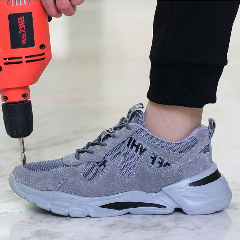 ภาพหน้าปกสินค้ารองเท้าเซฟตี้ รองเท้าเซฟตี้ผู้ชาย รองเท้าหัวเหล็ก ระบายอากาศ ป้องกันการชนและป้องกันการเจาะ