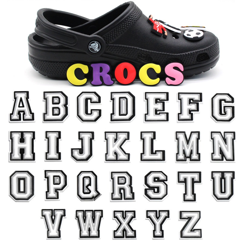 ภาพหน้าปกสินค้าใหม่ จี้ตัวอักษรภาษาอังกฤษ 26 ตัว สําหรับตกแต่งรองเท้า Crocs Jibbitz จากร้าน cyfisher.th บน Shopee