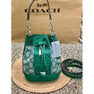 COACH MINI DEMPSEY BUCKET BAG IN SIGNATURE JACQUARD WITH STRIPE AND COACH PATCH