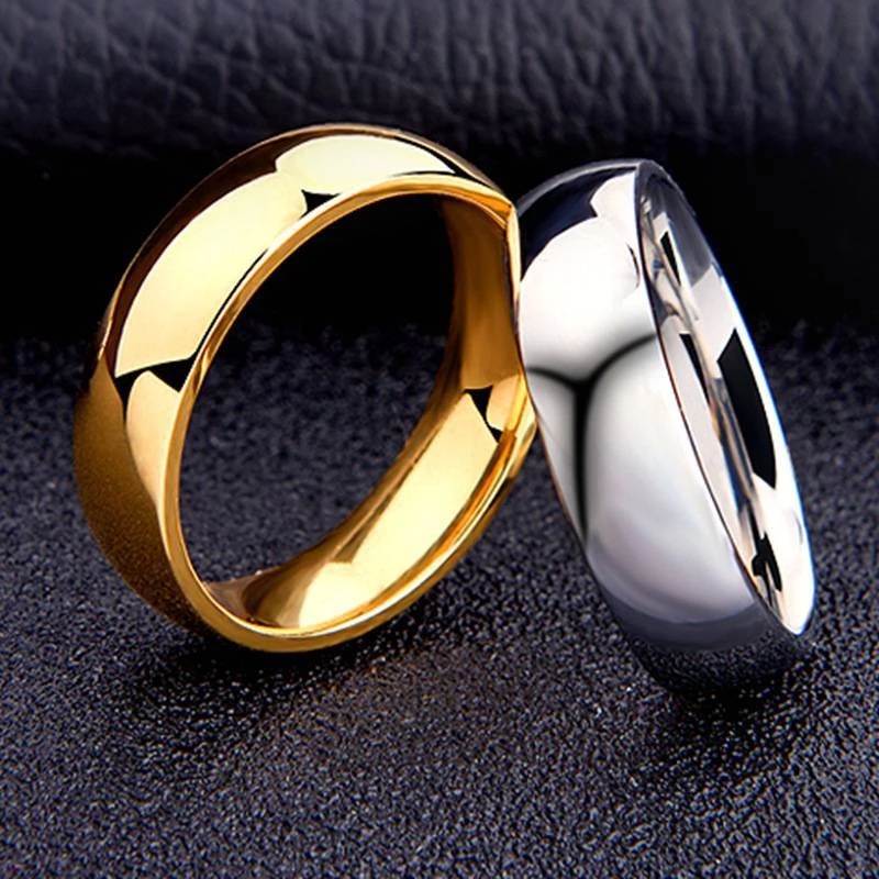 ภาพหน้าปกสินค้าแหวนโลหะไทเทเนียมสีทองเรียบง่ายสไตล์เกาหลี 6 มม. สําหรับผู้ชายและผู้หญิง จากร้าน exquise.th บน Shopee