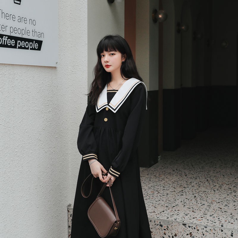 ภาพหน้าปกสินค้าReady stock ชุดเดรสสีดำสำหรับผู้หญิงฤดูใบไม้ร่วงปี 2020 ใหม่สไตล์เกาหลีหลวมเอวกระชับสไตล์วิทยาลัยญี่ปุ่นกระโปรงยาว