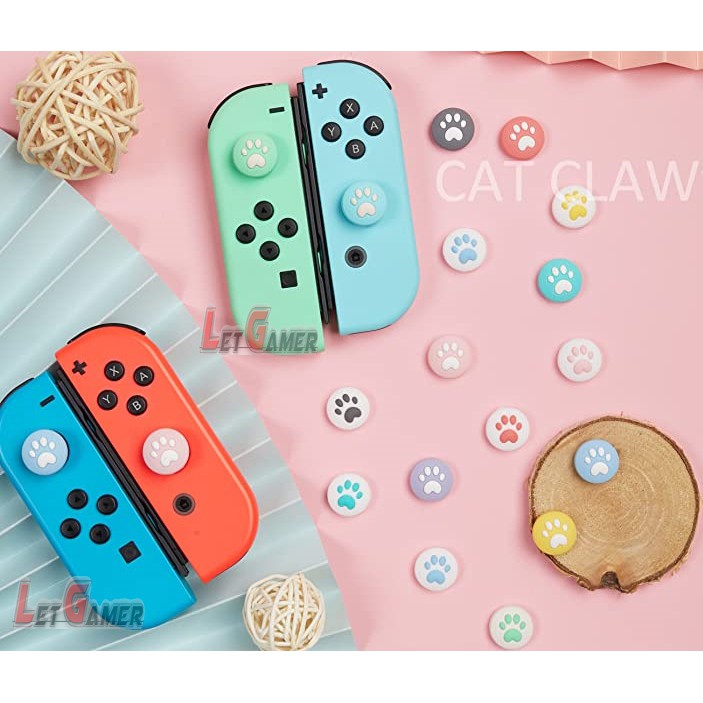 ภาพหน้าปกสินค้าสิลิโคนเท้าแมว Analog Caps Nintendo Switch / Switch OLED / Nintendo Switch Lite ( ชิ้นละ ) จากร้าน letgamer บน Shopee