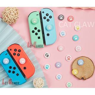 ภาพขนาดย่อของภาพหน้าปกสินค้าสิลิโคนเท้าแมว Analog Caps Nintendo Switch / Switch OLED / Nintendo Switch Lite ( ชิ้นละ ) จากร้าน letgamer บน Shopee