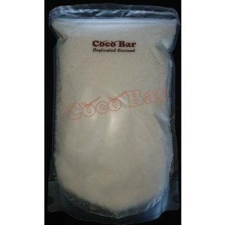มะพร้าวอบแห้งแบบไม่คั้นกะทิ ถุงละ 1 กก. ลังละ 10 กก. Desiccated Coconut High Fat 1 Kg. per Bag 10 Kg. per Box.