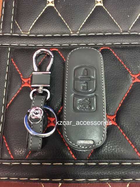 ภาพหน้าปกสินค้าซองหนังกุญแจ (3ปุ่ม) Mazda2/Mazda3/ CX-5 จากร้าน kzcar_accessories บน Shopee