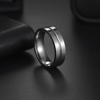 ภาพหน้าปกสินค้าใหม่ แหวนเหล็กไทเทเนียม สเตนเลส 6 มม. แฟชั่นเรียบง่าย สําหรับผู้ชาย และผู้หญิง ที่เกี่ยวข้อง