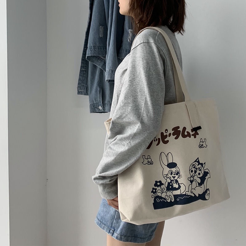 hot-new-bag-female-2022-new-ins-canvas-bag-female-studentกระเป๋าสะพายข้างความจุขนาดใหญ่-all-match-school-bag-tote-bag