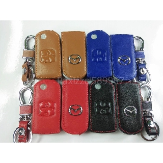 สินค้า ซองหนังแท้ MAZDA 2,3 [รุ่น 5 ประตู แบบกุญแจพับ 2 ปุ่ม] โลโก้เงิน(พร้อมส่ง)