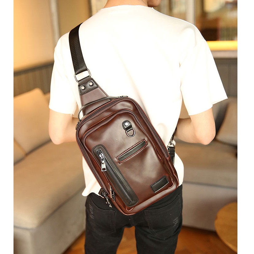 ภาพหน้าปกสินค้ากระเป๋าหนังกันน้ำ ผู้ชายคาดไหล่ ใส่ ipad10 นิ้ว แฟขั่นเกาหลี รหัส Man-6695 สีน้ำตาล