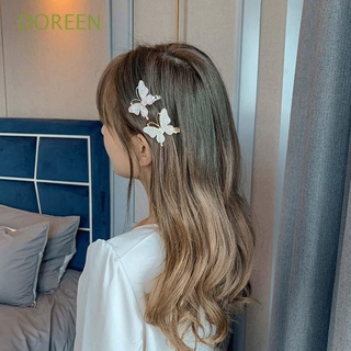 ภาพหน้าปกสินค้าDoreen กิ๊บติดผมรูปผีเสื้อประดับมุกสไตล์เกาหลีสําหรับผู้หญิง ที่เกี่ยวข้อง