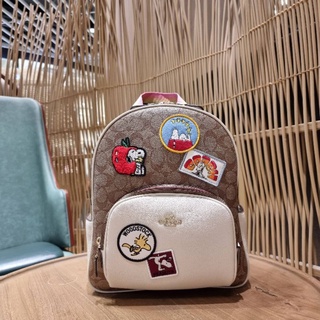 COACH COACHxPEANUTS COURT BACKPACK IN SIGNATURE CANVAS WITH VARSITY PATCHES