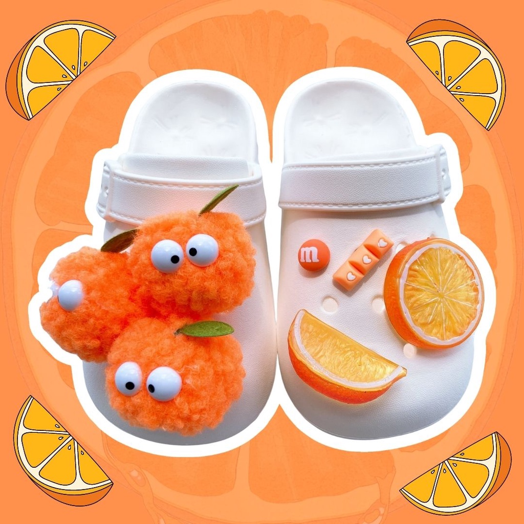 ภาพหน้าปกสินค้าOoyoudo Croc jibz จี้กระดุม แฟชั่น อุปกรณ์เสริมรองเท้า 10 ชิ้น ลูกบอลขนสัตว์ สีส้ม เลม่อน