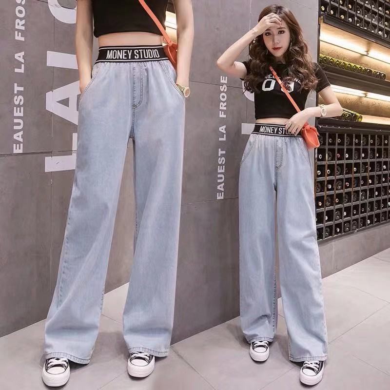 ภาพหน้าปกสินค้าFairy style กางเกงยีนส์ขายาวเอวสูง ขากระบอกเอวยางยืดดำ สกีนลายอักษร  8015 จากร้าน hongpaoxu บน Shopee