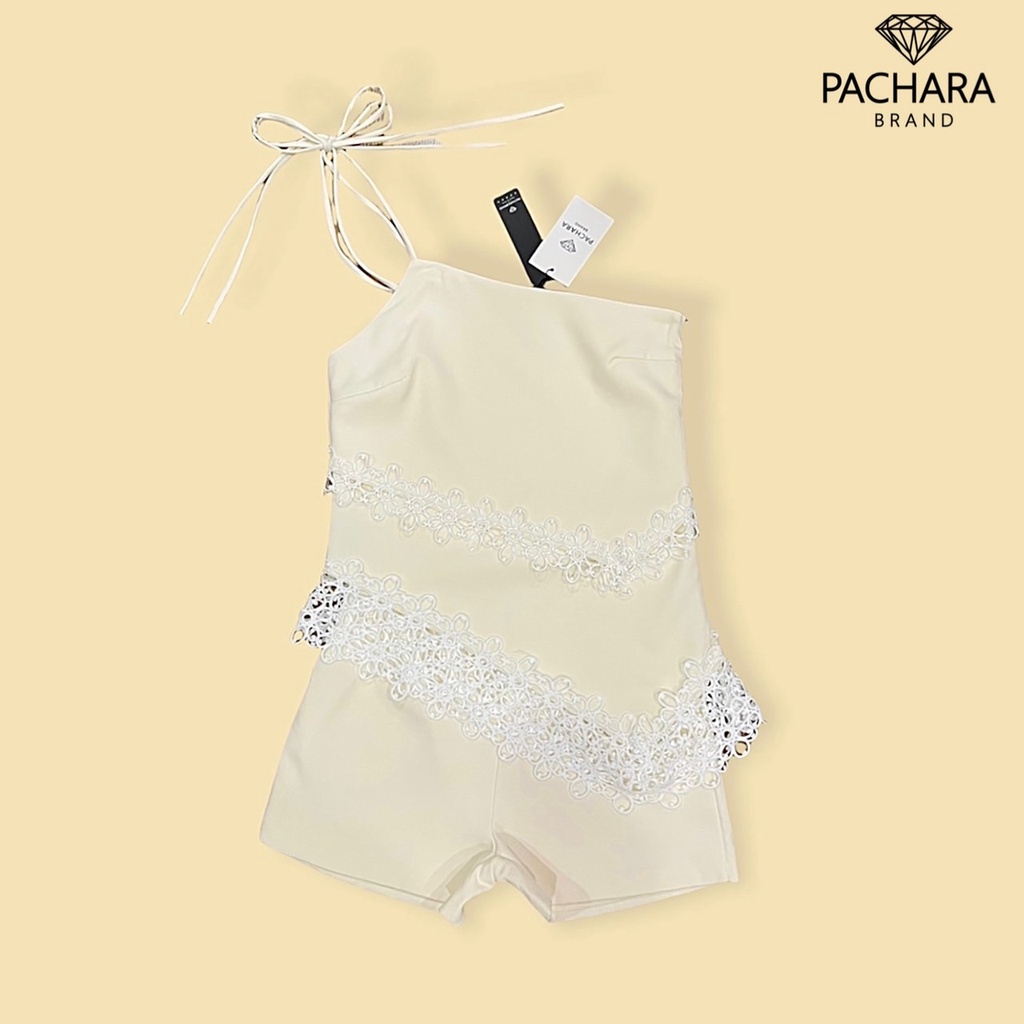 pachara-เซ็ต-2-ชิ้น-เสื้อผูกไหล่ด้านเดียวสีครีม-ชายเสื้อเฉียงแต่งลูกไม้สีขาว-แมทช์คู่กับกางเกงขาสั้นเอวสูง