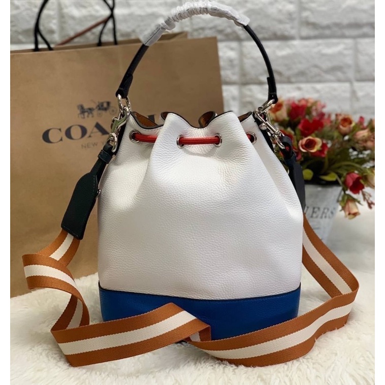 Coach jes drawstring bucket bag in colorblock with horse and carriage hotsell