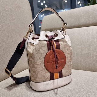 กระเป๋า COACH C7084 DEMPSEY DRAWSTRING BUCKET BAG IN SIGNATURE JACQUARD WITH STRIPE AND COACH PATCH