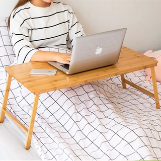 ภาพหน้าปกสินค้าโต๊ะวางโน๊ตบุค พับเก็บได้ ทำจากไม้ไผ่ คุณภาพสูง โต๊ะวางหนังสือ โต๊ะไม้ โต๊ะญี่ปุ่น โต๊ะ wooden notebook table Japanese ที่เกี่ยวข้อง