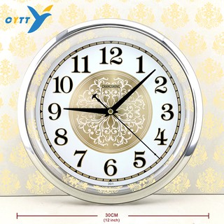 ภาพหน้าปกสินค้าCYTTL นาฬิกาแขวนผนัง  ทรงกลม12 นิ้ว หน้าปัดนาฬิกาจะเป็นกระจกมองเห็นชัดเจน ที่เกี่ยวข้อง