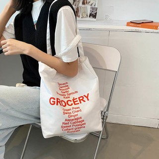 ภาพหน้าปกสินค้า🍓กระเป๋าสะพาย กระเป๋าผ้าใบ กระเป๋า​ใส่หนังสือ สไตล์เกาหลี grocery ลายตัวอักษร 5สี ซึ่งคุณอาจชอบราคาและรีวิวของสินค้านี้