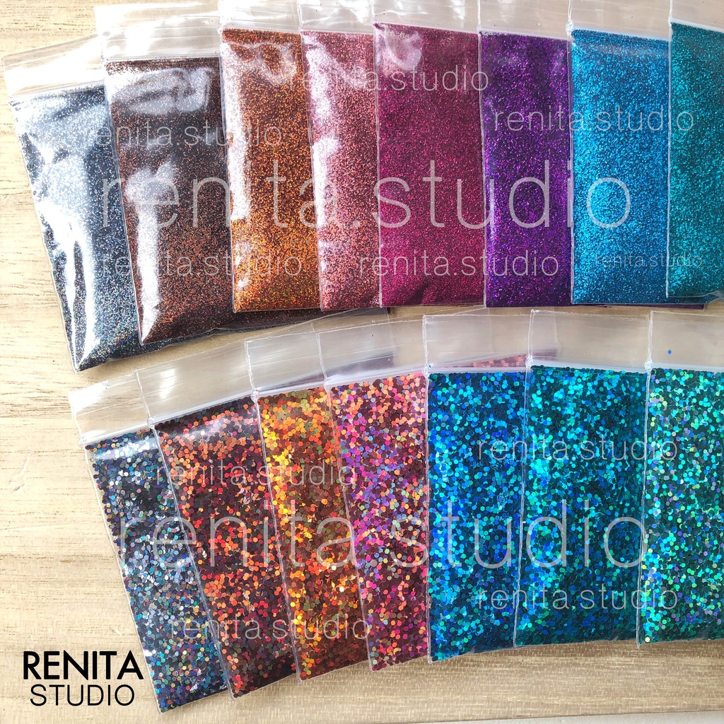 ภาพหน้าปกสินค้ากากเพชรสีรุ้ง ซอง 10 กรัม ตกแต่งเล็บ DIY รหัส 13-23 จากร้าน renita.studio บน Shopee