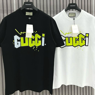 Guc เสื้อยืดคอกลม แขนสั้น ผ้าฝ้ายแท้ พิมพ์ลายโลโก้ตัวอักษร สีเขียวเรืองแสง คุณภาพสูง แฟชั่นสําหรับผู้ชาย และผู้หญิง
