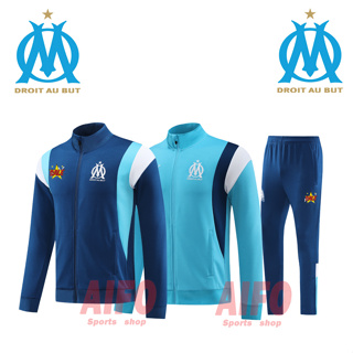 Marseile เสื้อแจ็กเก็ต แขนยาว สีฟ้า และกางเกงกีฬาฟุตบอล สําหรับผู้ชาย 2023