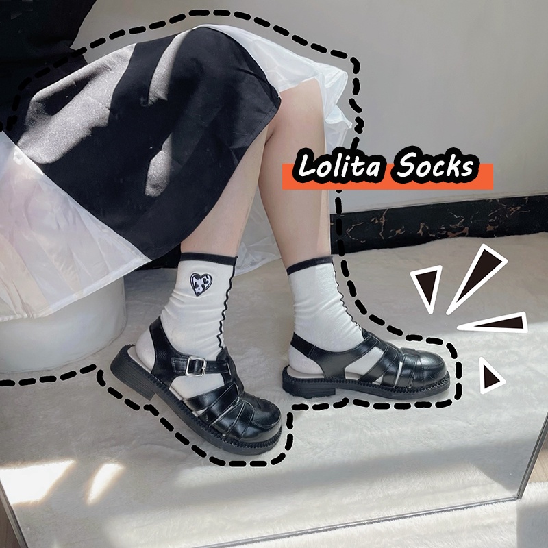 ภาพหน้าปกสินค้าญี่ปุ่น Lolita ถุงเท้าผู้หญิงอินเทรนด์ถุงเท้ากลางสีดำสีขาวหัวใจเย็บปักถักร้อยหญิงกีฬาถุงเท้าผ้าฝ้ายถุงเท้าข้อเท้า