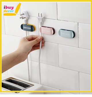 ibuydecor ที่แขวนสายไฟติดผนัง ที่เก็บสายไฟ ที่แขวนสายไฟ ที่แขวนปลั๊กไฟ  Plug holder wall Plug socket holder 00051-54