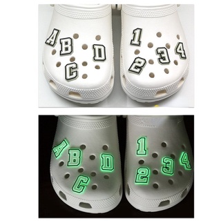 ภาพขนาดย่อของภาพหน้าปกสินค้าจดหมายเรืองแสงในที่มืด น่ารัก สําหรับ Croc Shoe Charms Luminous Jibitz Letters Jibits Crocks สําหรับผู้ชาย ตกแต่งรองเท้า จากร้าน keduoduo.th บน Shopee