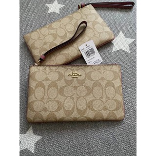 กระเป๋าคล้องมือ Coach ไซส์ L 1 ซิป  LARGE WRISTLET IN SIGNATURE COATED CANVAS (COACH F58695) สีชมพู