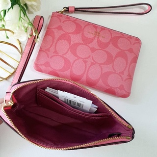 ภาพขนาดย่อของสินค้าพร้อมส่ง แท้   % New Coach 1 ซิป S รุ่น CORNER ZIP WRISTLET IN SIGNATURE CANVAS (COACH 91178) IM/PINK