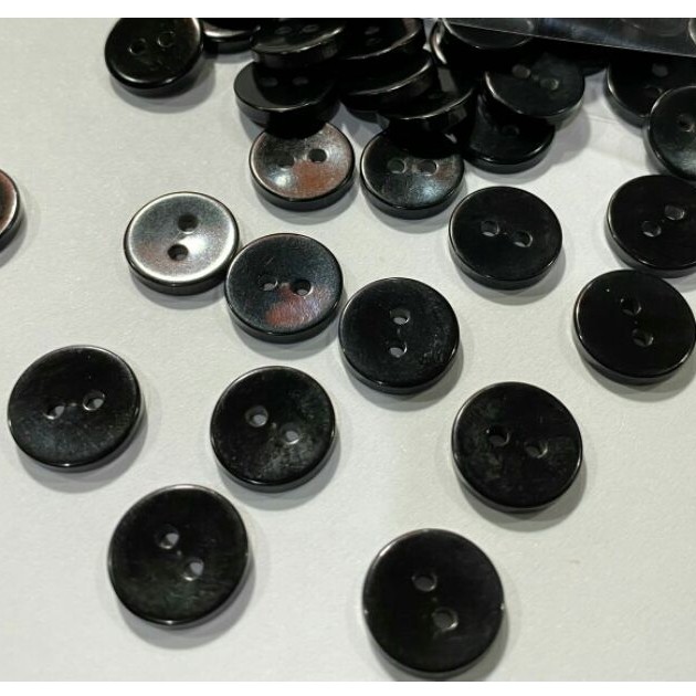 ภาพหน้าปกสินค้าโล๊ะสต็อก กระดุมเสื้อเชิ้ต ติดกางเกง11.5มิล(100เม็ด)สีดำสวยเรียบๆแต่ดูหรูหราDis1750