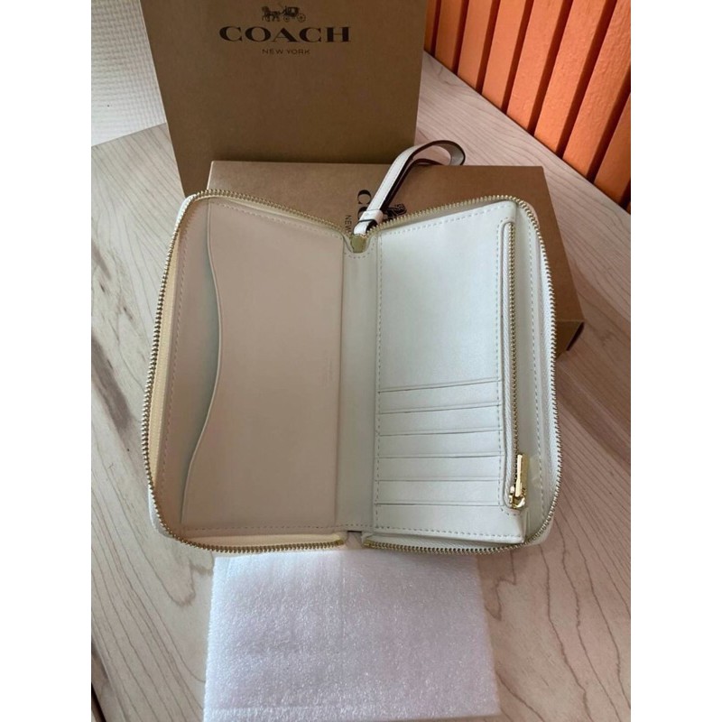 coach-phone-wallet-in-signature-coated-canvas-cream