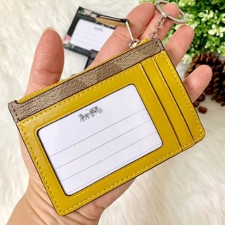 Coach พวงกุญแจ ใส่บัตร ใส่เหรียญได้ F16107 สีเหลือง ลายซี